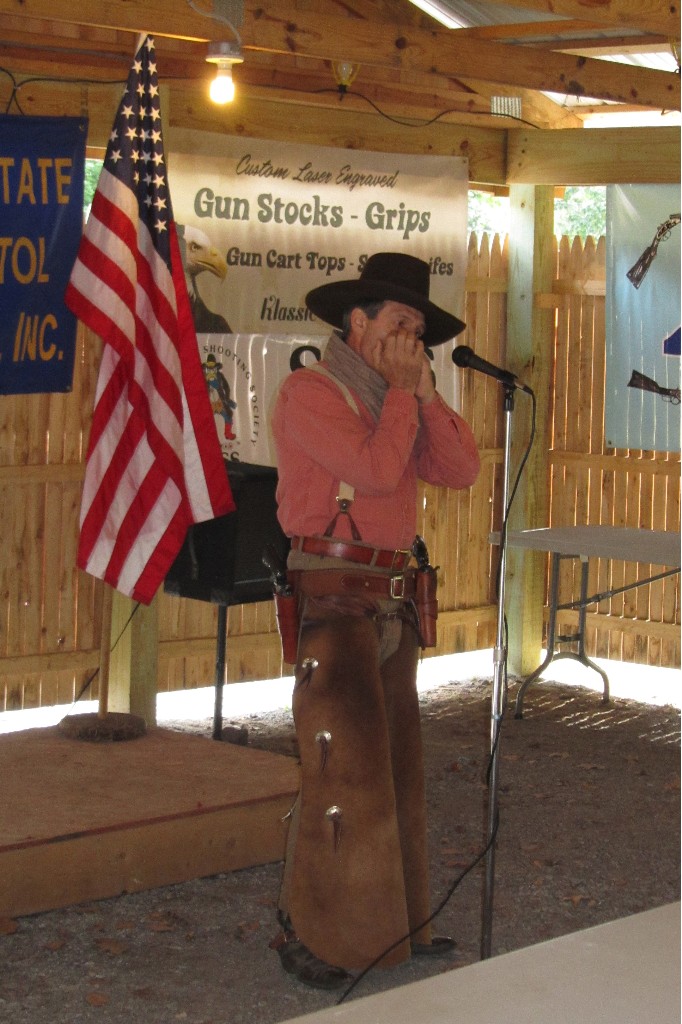 Tom Payne playing the National Anthem on the harmonica.